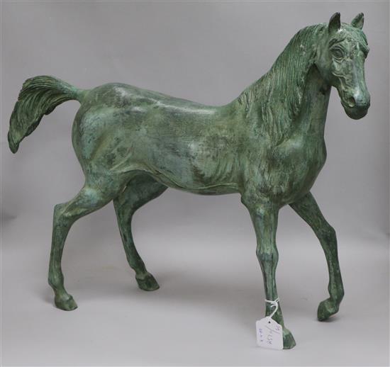 A green bronze model of a stallion height 47cm width 60cm